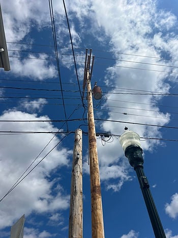 Two utility poles in close proximity to each other, called double wood. 